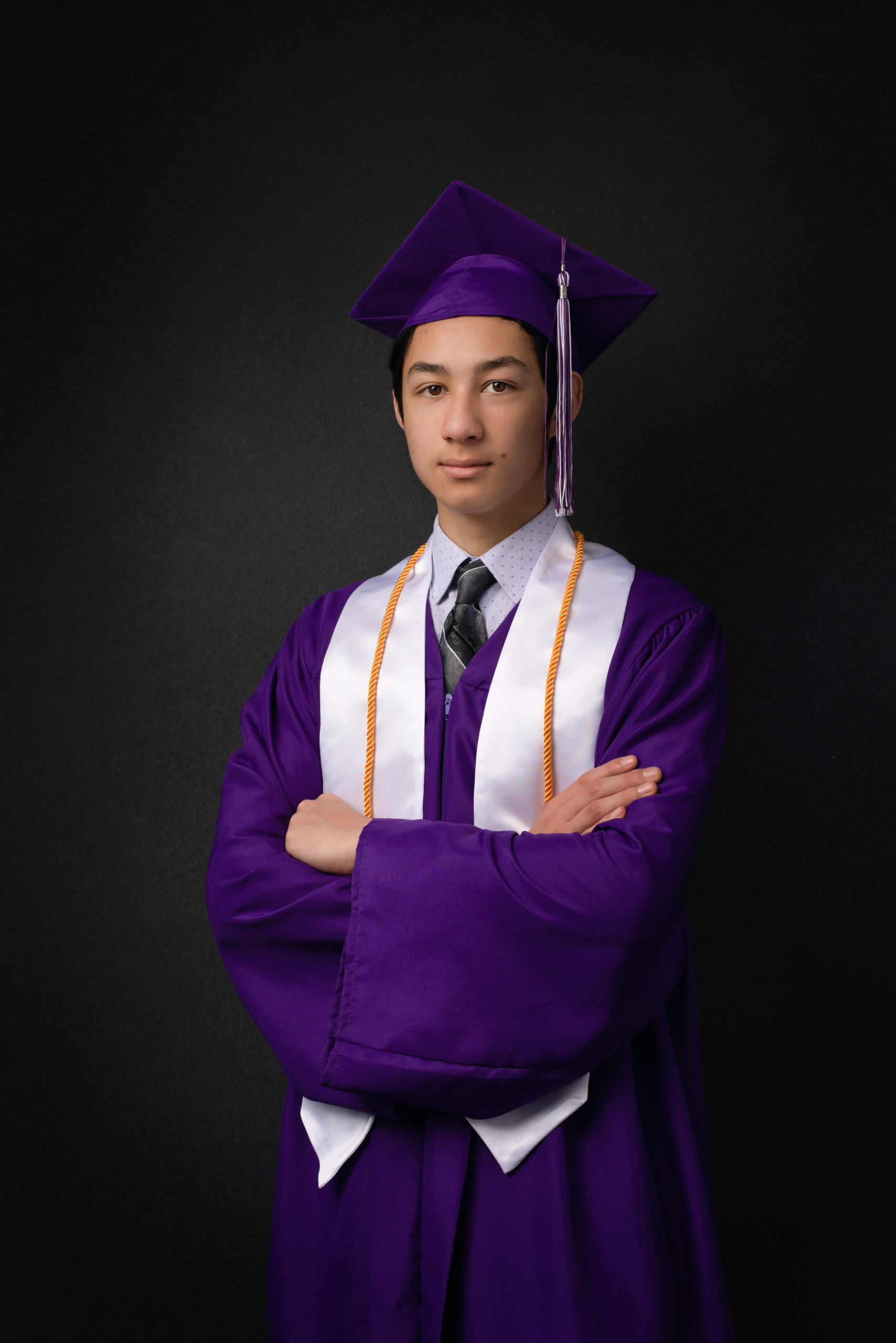 Graduating student with cap and gown